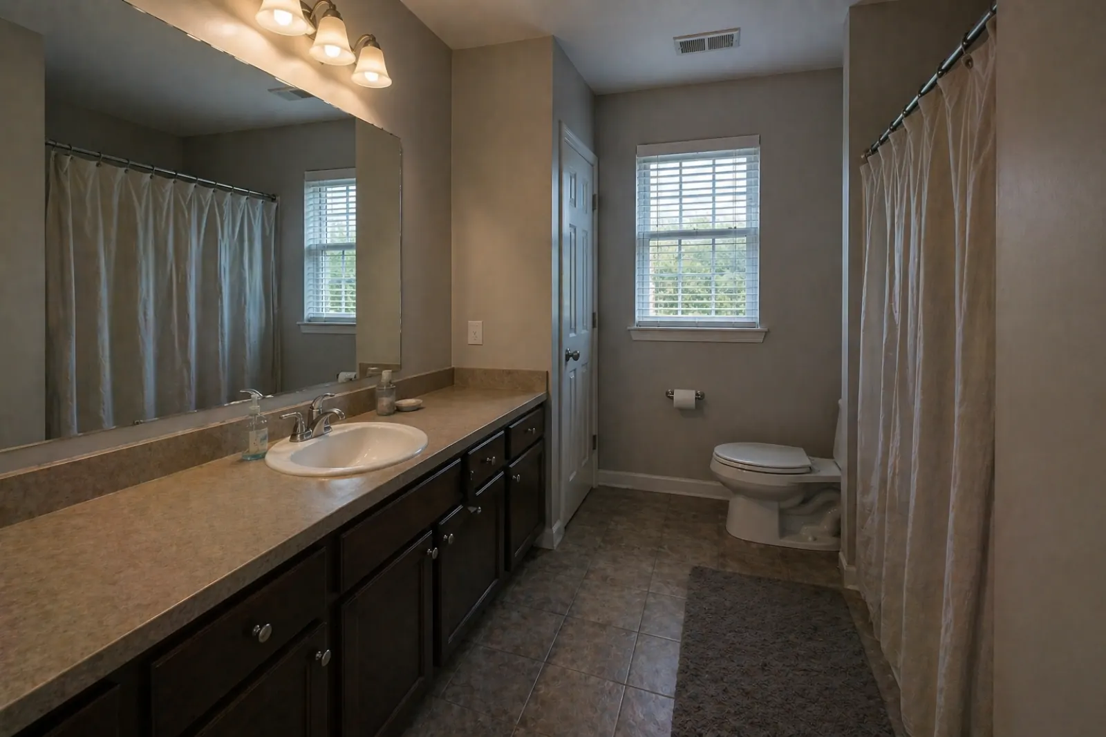 Bathroom — dim & dated to spa-clean — before